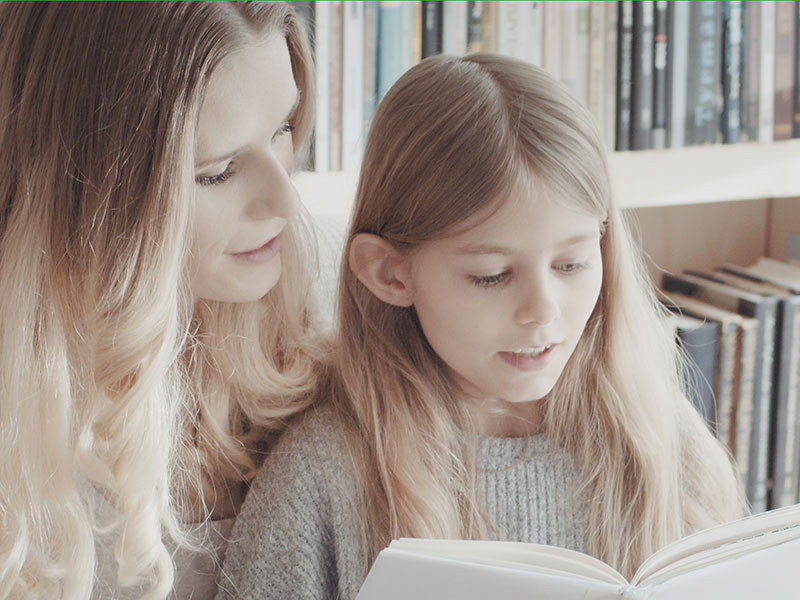 Mother and daughter reading