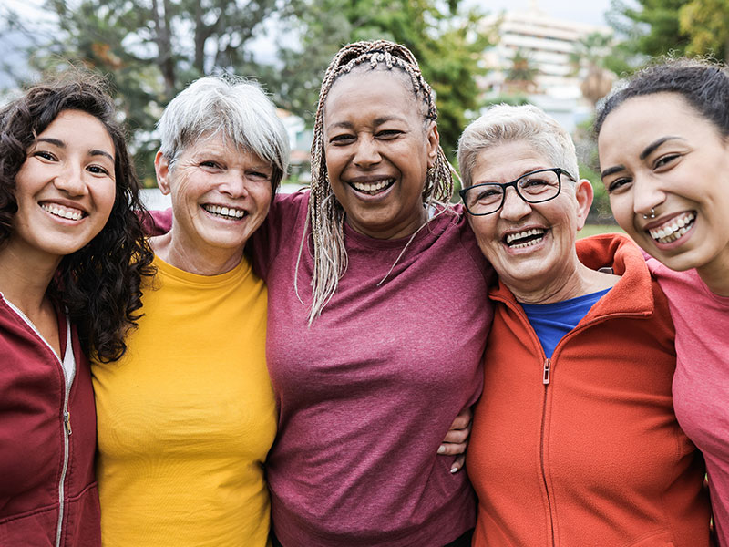 Group of women hugging and laughing