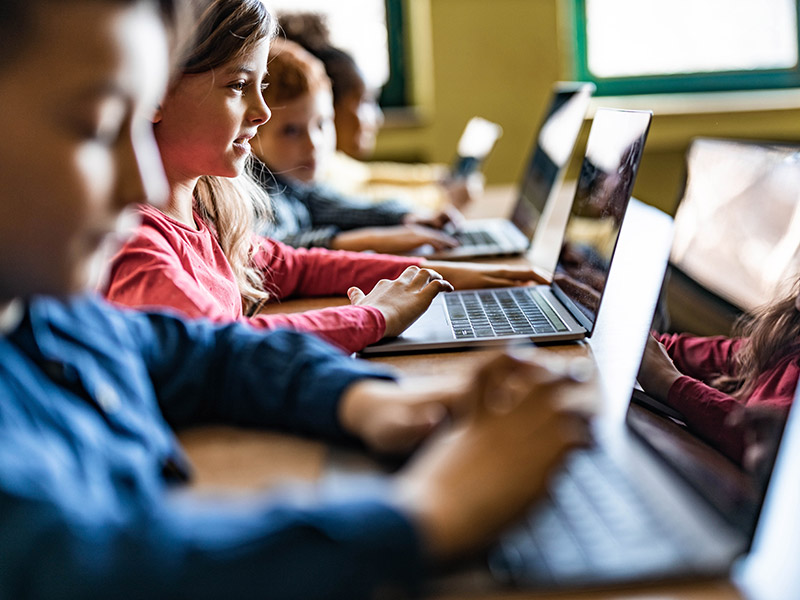 Children working with laptops